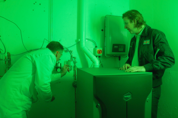 Close up of Avioxx engineer working with their lab-scale Fischer-Tropsch reactor